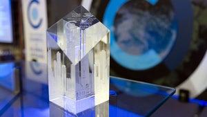 A glass award on top of a table