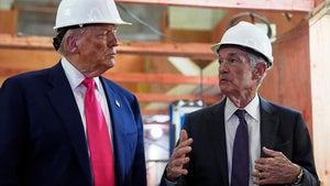 President Donald Trump listens as Federal Reserve Chairman Jerome Powell speaks during a visit to the Federal Reserve
