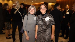 Two women pose for a photo at the 2024 Consular Corps Reception.