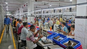 Workers in a manufacturing unit make leather footwear in Agra, India on August 25, 2025.