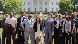 Group of people standing outside the White House.
