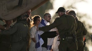An Israeli hostage released from the Gaza Strip walks off a helicopter at the Sheba Medical Center in Ramat Gan, Israel
