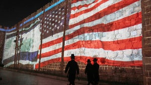 n Image of the US and Israeli flags is projected on the walls of Jerusalem's Old City