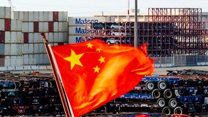  A Chinese flag flies from a ship at the Port of Oakland