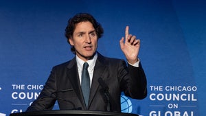 Justin Trudeau speaks while standing behind a podium