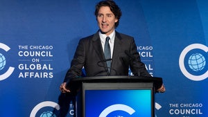 Justin Trudeau speaks while standing behind a podium