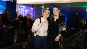 Two event attendees pose for a photo at the Chicago Council Conference Center.