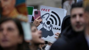 Protesters participate in a demonstration supporting protesters in Iran, in front of the US Consulate, Milan, Italy, Tuesday, Jan. 13, 2026.