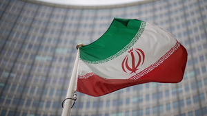 The Iranian flag waves in front of the building of the International Atomic Energy Agency, in Vienna, Austria on December 17, 2021.