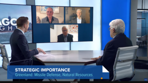 Three speakers appear on screen and two appear in a television studio