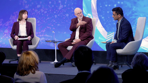 Speakers on the Council's stage.