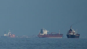 Oil tankers and cargo ships line up in the Strait of Hormuz