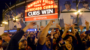 Chicago Cubs fans celebrate outside Wrigley Field after the team clinched the National League Division Series against the St. Louis Cardinals on October 13, 2015.