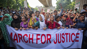 University students at a protest hold a banner that reads "MARCH FOR JUSTICE" in red letters in Dhaka, Bangladesh on July 31, 2024.