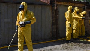 Ukrainian emergency workers wearing radiation protection suits attend training in Zaporizhzhia, Ukraine.