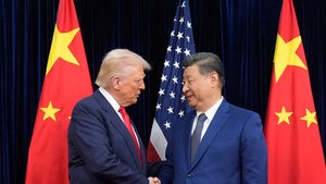 Trump and Xi Jinping shaking hands in front of US and Chinese flags