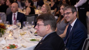 People sit around a dinner table