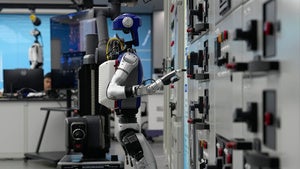Artificial Intelligence robots demonstrate working on power grid control units in China