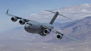A U.S. Air Force Boeing C-17 Globemaster III T-1 flies over Owens Valley to Edwards Air Force Base, California
