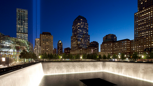 The Tribute in Light shines above a reflecting pool at the National September 11 Memorial in New York City on September 11, 2012.
