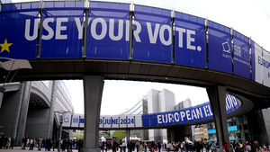 Banners that read "Use Your Vote" hang above the European Parliament during Europe Day celebrations in Brussels on May 4, 2024.