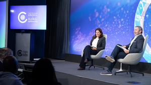Leslie Vinjamuri and Tom Wyler sitting onstage at a Chicago Council on Global Affairs event.