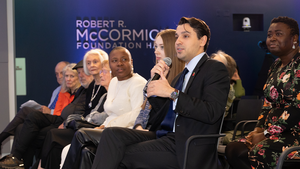 An event attendee asks a question during a Council event Q&A.