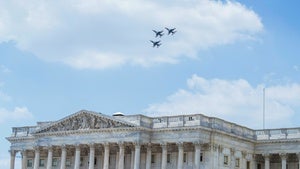 Three fighter jets fly over the US Capitol Building