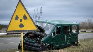 A radiation sign in front of a Russian military vehicle near the Chernobyl nuclear power plant, April 16, 2022. 
