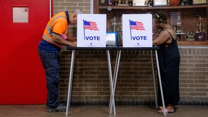 People vote in the primary election at Northwestern High School in Detroit