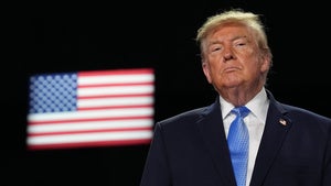 Donald Trump pictured in front of an American flag