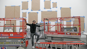 Artist Rashid Johnson stands in front of artwork featured in his first solo exhibition at the Museum of Contemporary Art in Chicago on April 6, 2012.