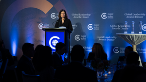 A person speaking at a podium