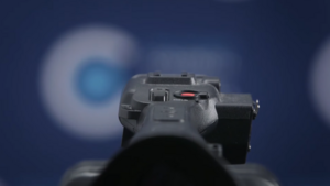Video camera with Council logo in the background