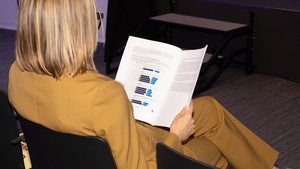 Person holding a research report