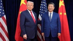 President Donald Trump, left, and Chinese President Xi Jinping pose ahead of their summit talk at Gimhae International Airport in Busan, South Korea, Thursday, Oct. 30, 2025.