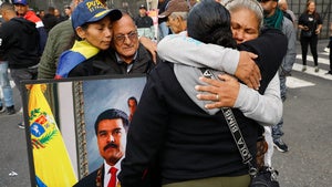 Supporters of Venezuelan President Nicolás Maduro embrace in downtown Caracas, Venezuela, Saturday, Jan. 3, 2026, after U.S. President Donald Trump announced that Maduro had been captured and flown out of the country. 