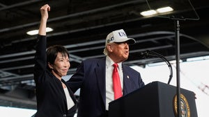 President Donald Trump, with Japanese Prime Minister Sanae Takaichi, speaks to members of the military aboard the USS George Washington, an aircraft carrier docked at an American naval base, in Yokosuka, Tuesday, Oct. 28, 2025. 