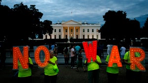 Protesters hold signs spelling out, "No War," outside the White House, Thursday June 20, 2019, in Washington, after President Donald Trump tweeted that "Iran made a very big mistake" by shooting down a U.S. surveillance drone over the Strait of Hormuz in Iran.