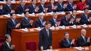 Chinese President Xi Jinping, center front, attends the opening session of the Chinese People's Political Consultative Conference in the Great Hall of the People in Beijing, Monday, March 4, 2024. 
