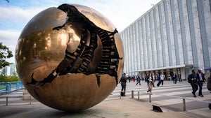 People walk around the plaza by the Sphere Within Sphere outside the United Nations Headquarters on the first day of the 80th session of the UN General Assembly's High-Level week, Monday, Sept. 22, 2025. 