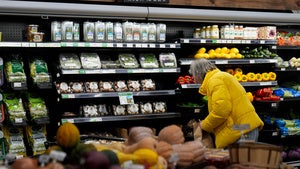 A shopper looks at produce at a grocery store Tuesday, Feb. 10, 2026, in Chicago.